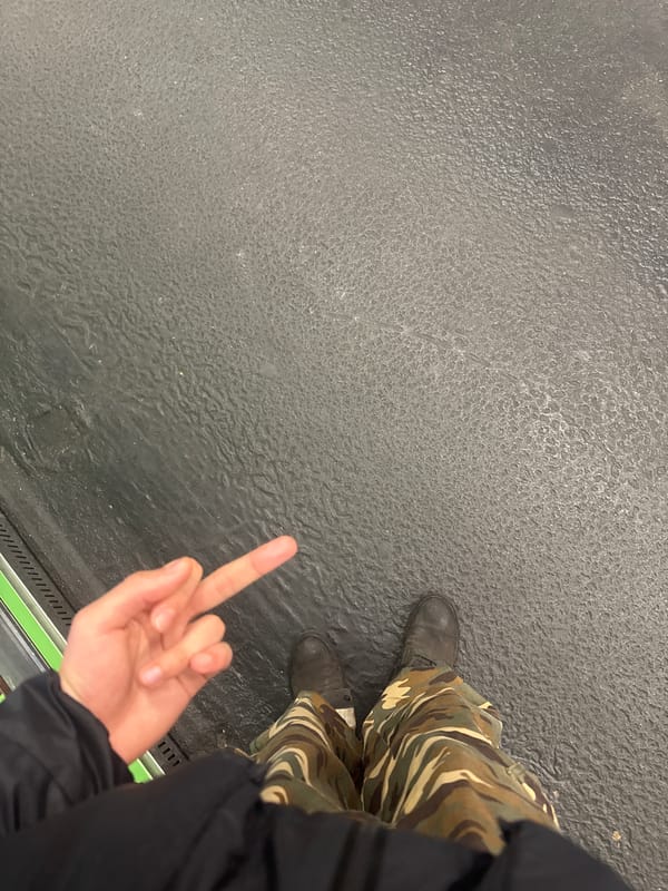 Two people make hand gestures at Paris metro platform