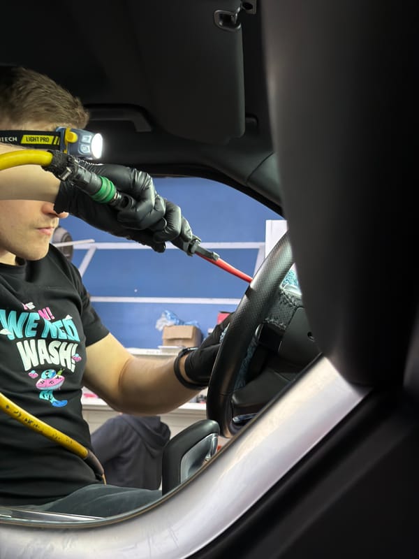 Professional car detailing service documented in Krasnoyarsk garage