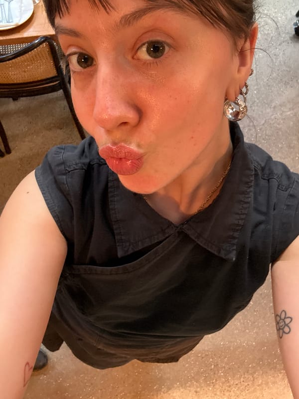 Two people take selfies indoors in London