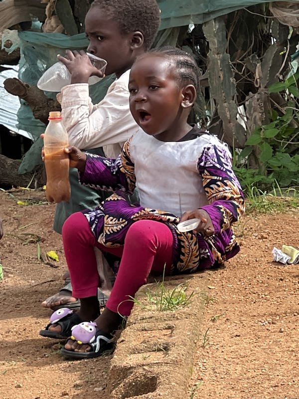 Kids gathered outdoors on the streets of Jos, Nigeria
