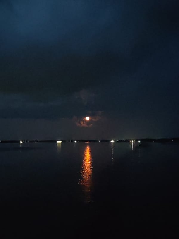 Sunset to moonrise over a Russian waterway