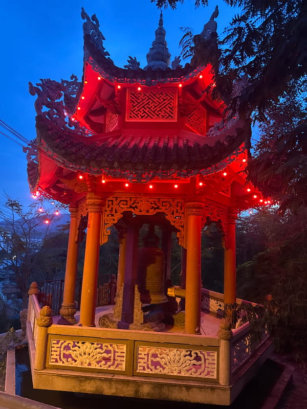 Long Son Pagoda at dusk, dragons and Buddha lit up