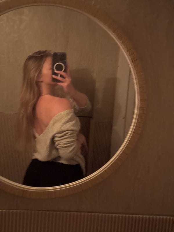 Person Takes Selfie in Round Mirror in Herzliya