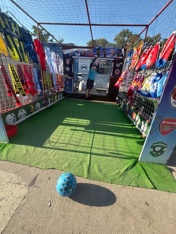 Plush toy prize booth set up at a sunny Varna fair