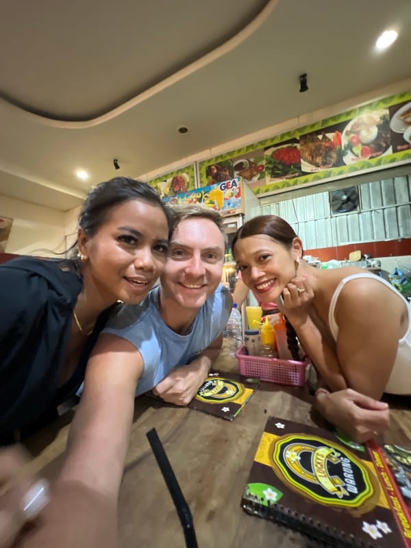 Three friends take selfie at Kuta restaurant