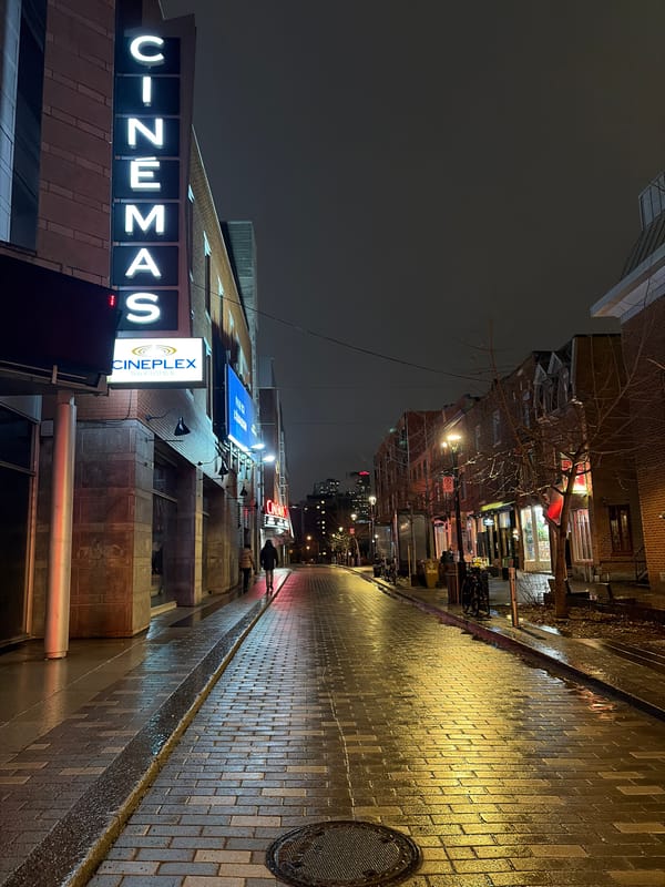 Late-night Montreal street scenes captured near cinemas and restaurant