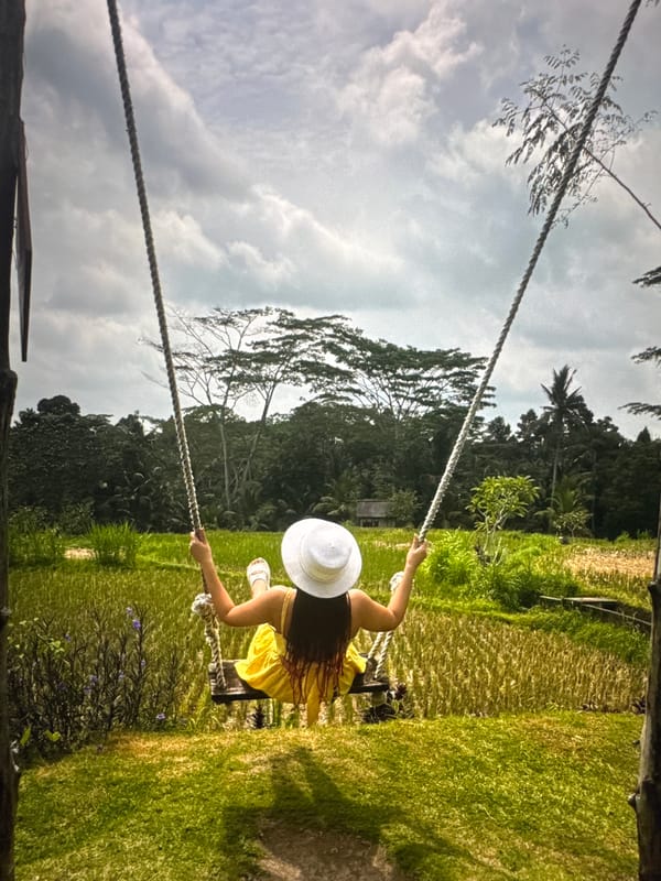 Couple enjoys outdoor recreation, woman swings while man photographs