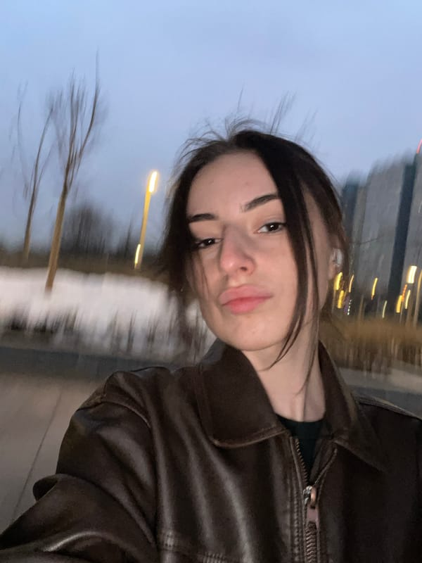 Young Woman Takes Evening Selfies on Swing in Moscow Park