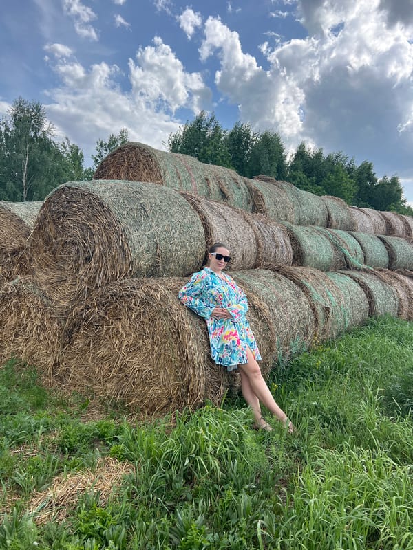 Family enjoys rural hay bale playground in Kirillovka