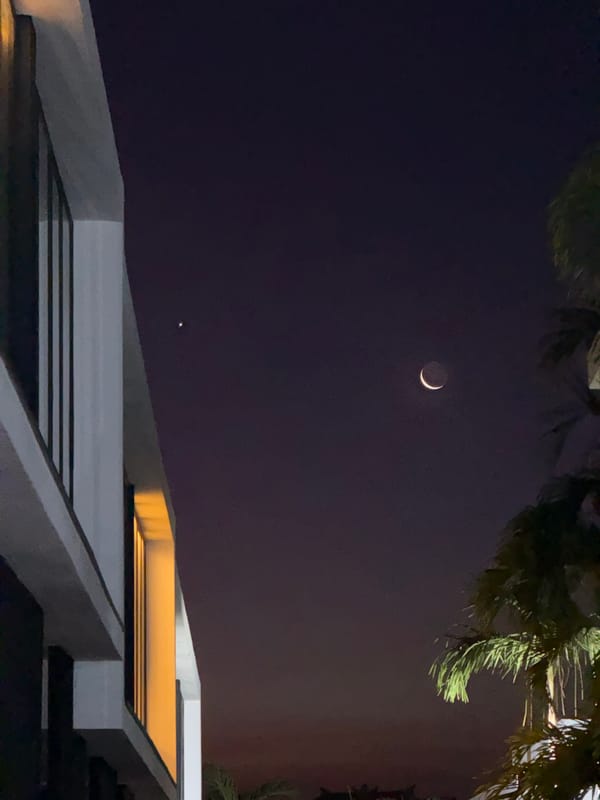 Crescent moon and bright planet observed in North Kuta night sky