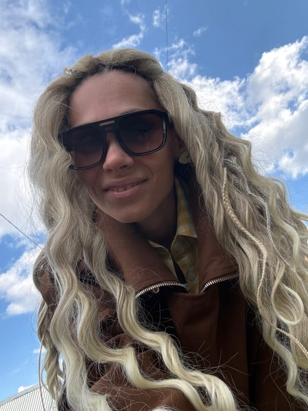 Woman takes multiple selfies outdoors in Rusanovo, Russia