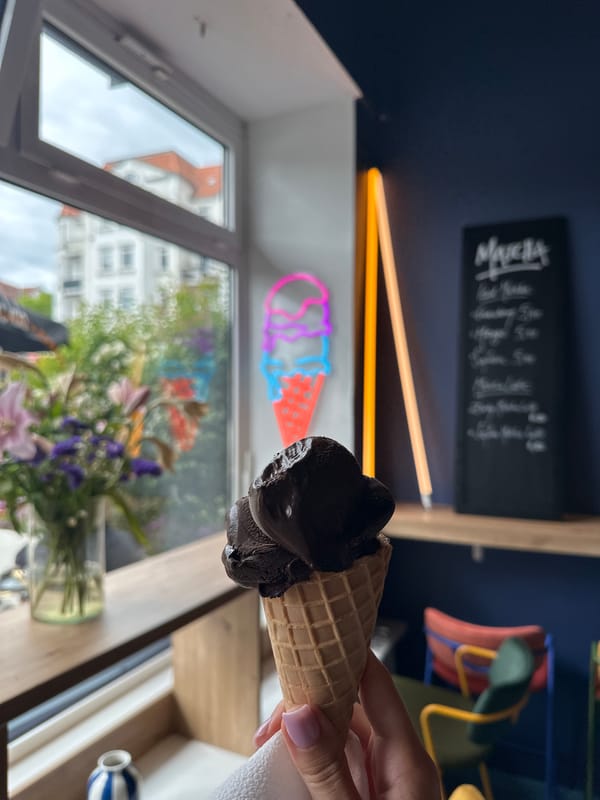Customer enjoys chocolate ice cream at Kiel parlor