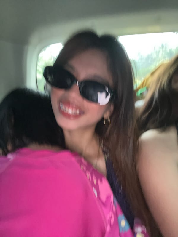 Person in pink floral top photographed smiling in Bongabong