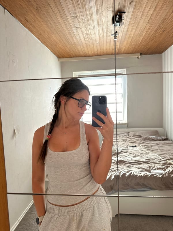 Woman Takes Multiple Selfies in Fredenbeck Bedroom