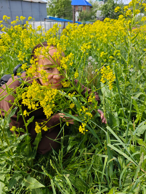 Woman photographed among wildflowers in Markovo, Russia countryside