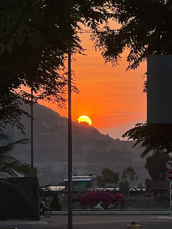 Sunset observed over mountains in Nam Nha Trang Ward