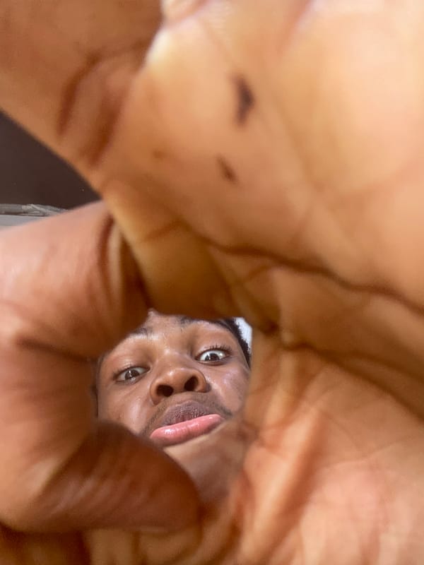 Young man photographs himself inside Ado barbershop during morning visit