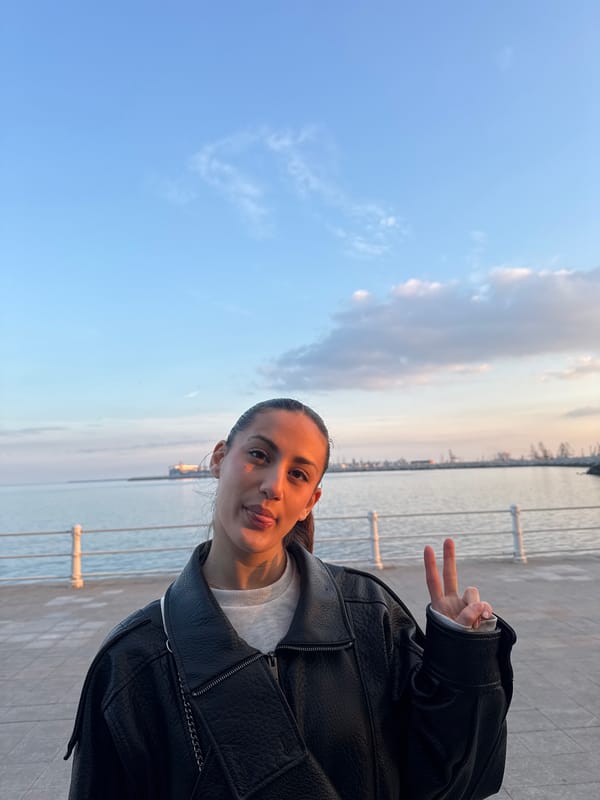 Woman takes selfie at waterfront location