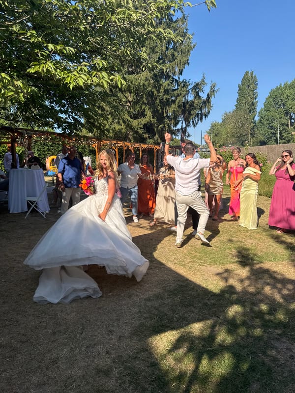 Sunny outdoor wedding reception in Hem, bouquet toss and all