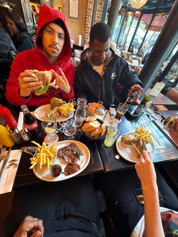 Two people dine at Paris restaurant window table