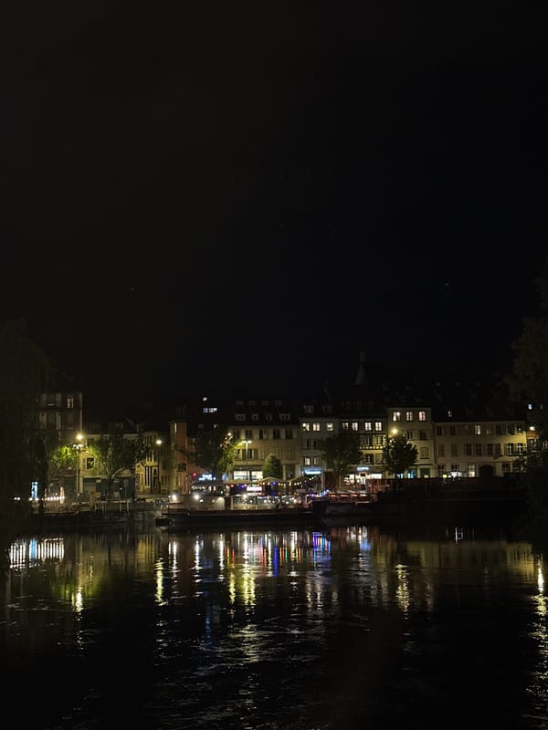 Evening stroll documented along Strasbourg's illuminated canals