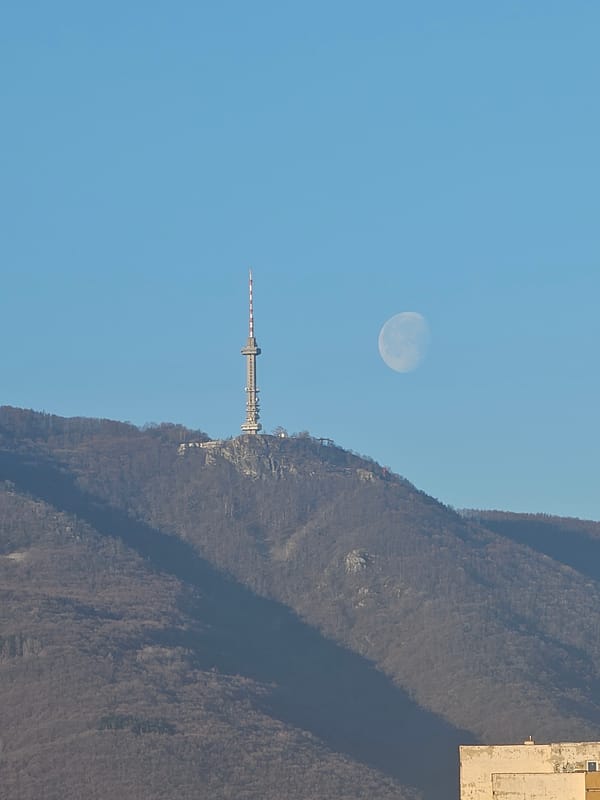 Half moon visible above Kopitoto TV Tower, Sofia