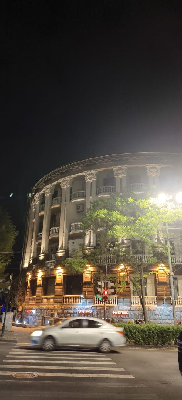 Illuminated rounded building observed at night in Yerevan