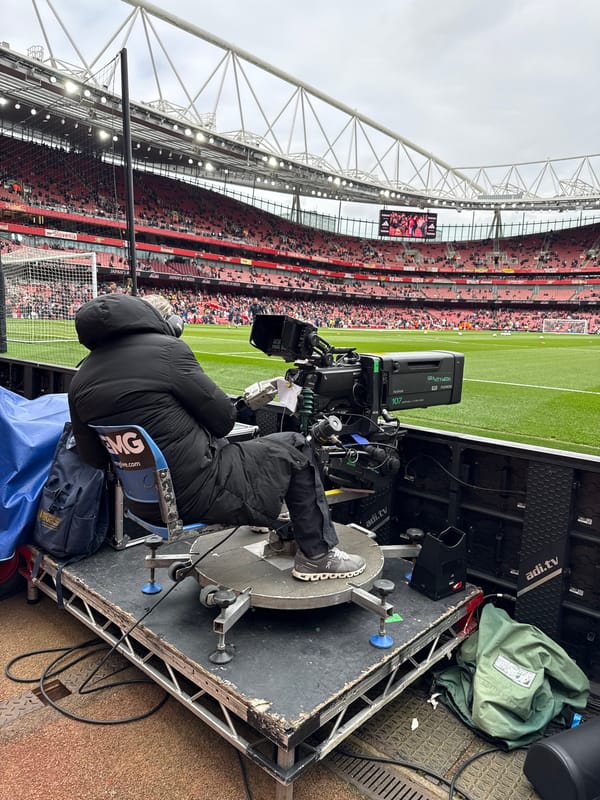 Camera operator working at Arsenal stadium in London