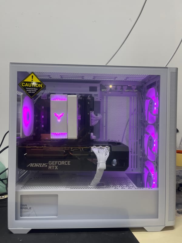 Open white PC case showing RTX GPU and purple LED internals