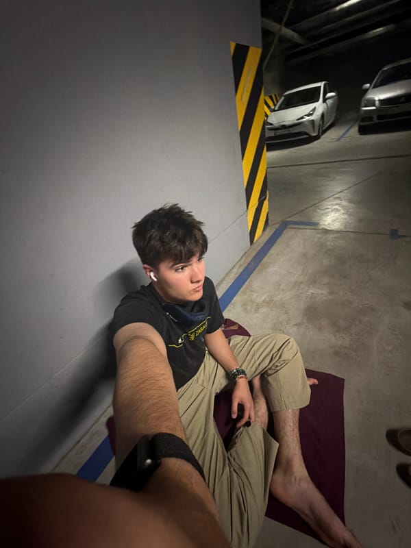 Quiet moment on a mat inside a Kyiv parking garage