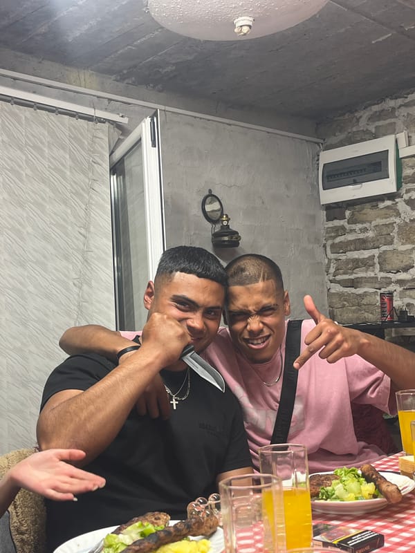 Young men share evening meal and drinks in Lozarevo