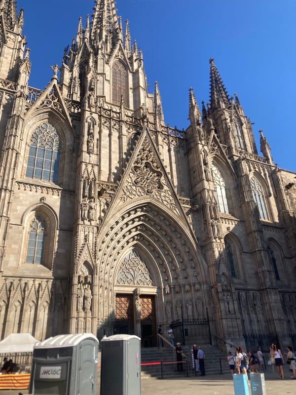 Gothic Quarter buzzes with crowds and event logistics on sunny afternoon
