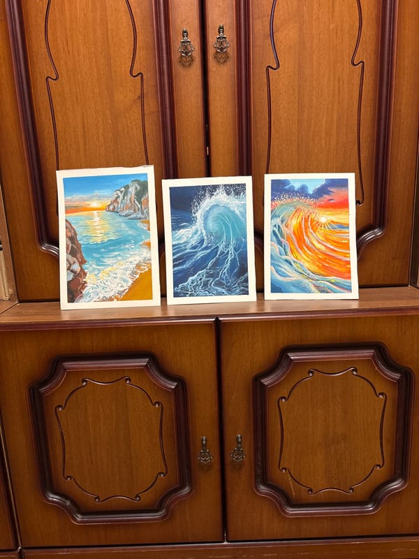 Amateur coastal painting displayed on easel in Izhevsk