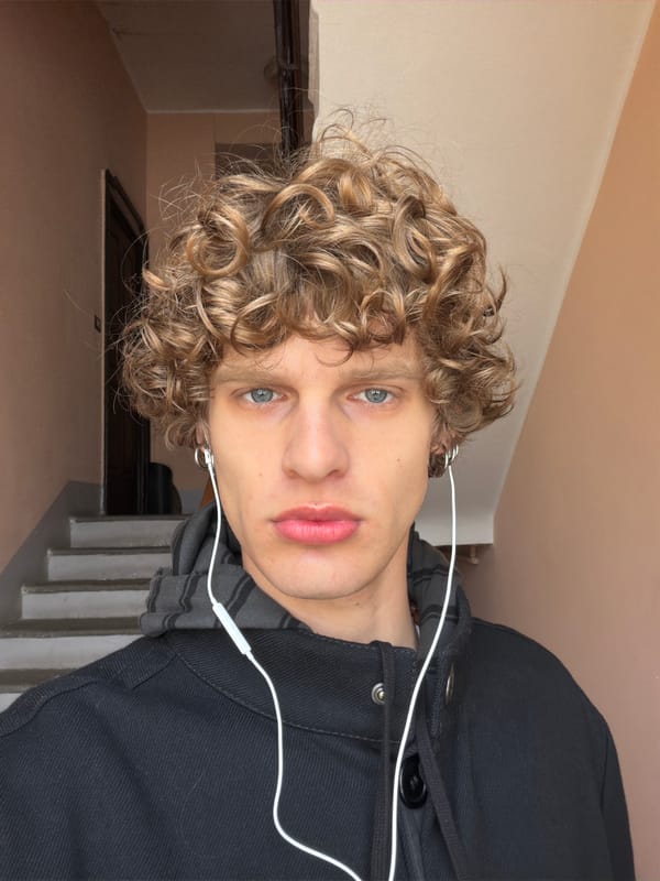 Morning commuters descend stone stairs in central Milan