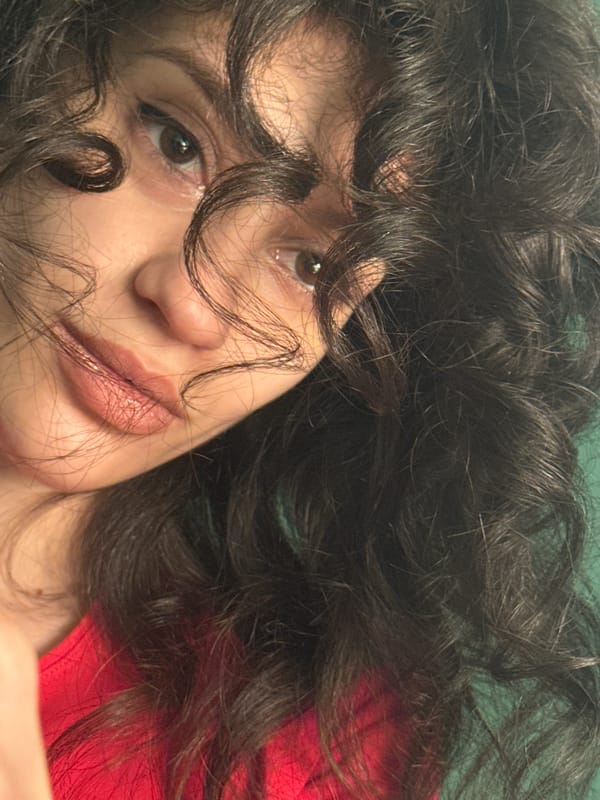 Woman takes 21 selfies in red shirt during evening in Sofia
