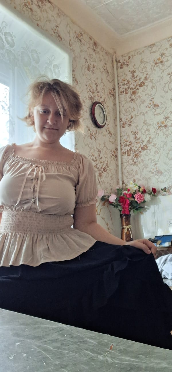 Indoor OOTD fashion shoot in Petropavl with ruffled blouse and white rose