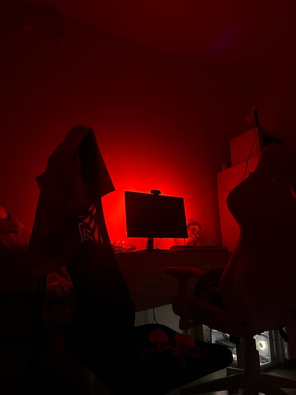 Red-lit interior with monitor and desk observed in Lyubertsy