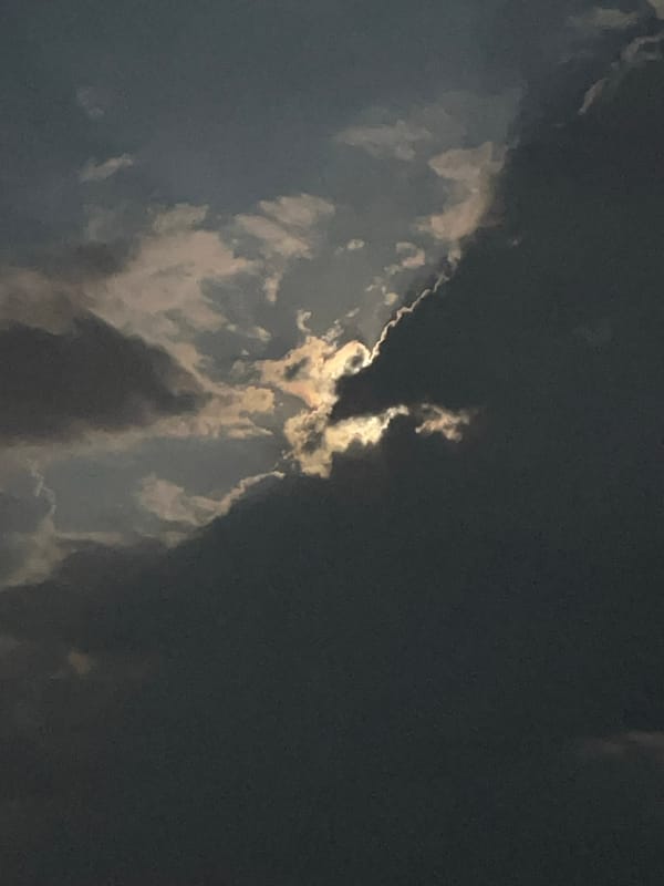Moonlit clouds over the coast of Baošići at night