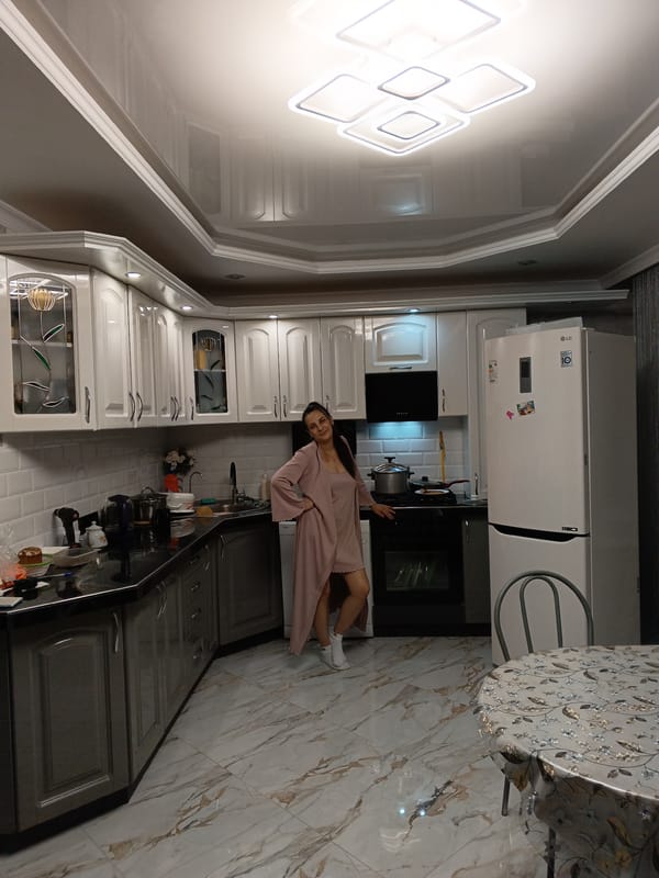 Young man takes selfies with household objects in Andreyevo