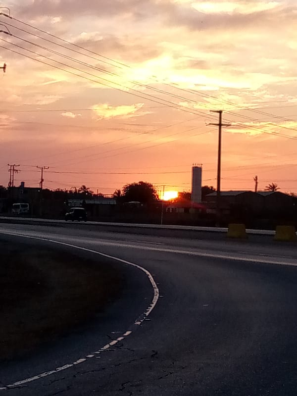 Sunset captured over curved road in El Dátil, Venezuela