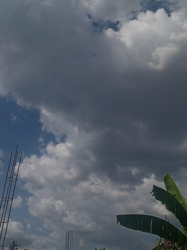 Storm clouds shift over residential Parroquia Ocumare, Venezuela