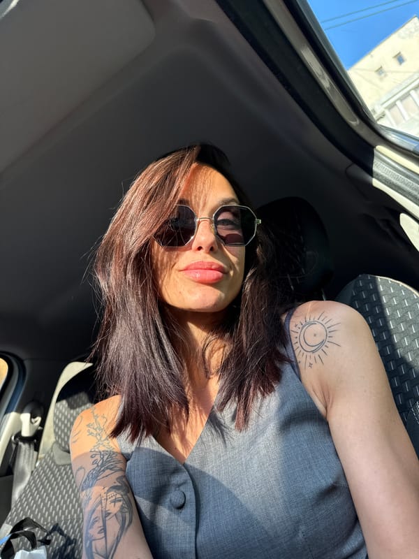 Woman with sun tattoo photographed in car, Pleven Bulgaria