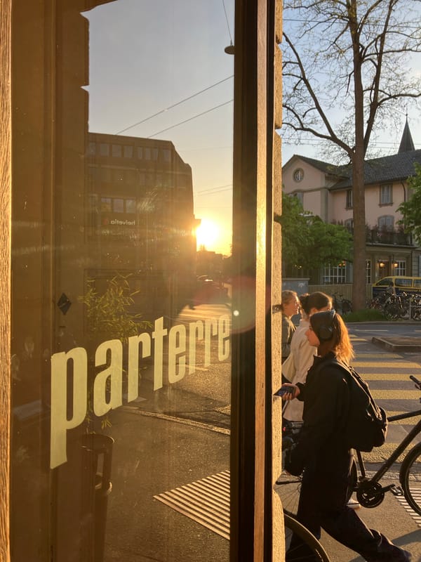 Street scene photographed through window in golden sunlight