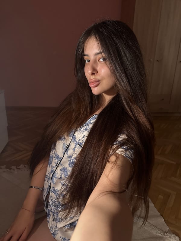 Woman documents evening selfie session in Plovdiv bedroom