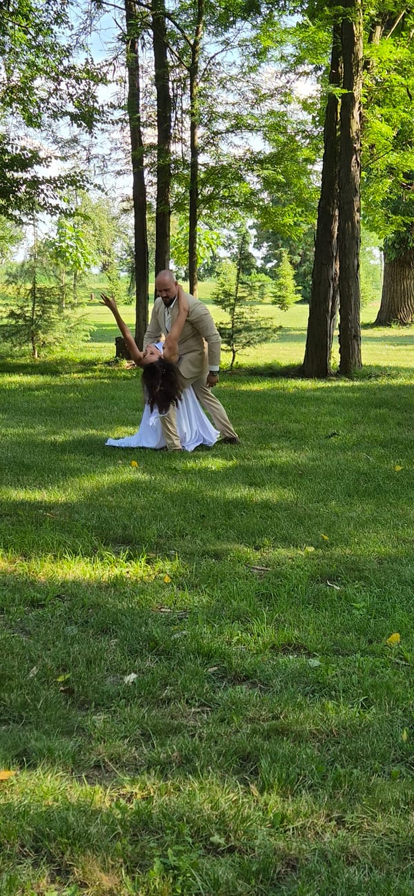 Outdoor dance moment on a grassy lawn in Bulgaria