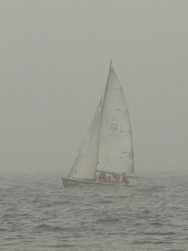 Sailboat navigates dense fog off Tel Aviv coast