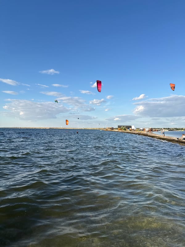 Kitesurfers out on the water near Ukrainka on a sunny day