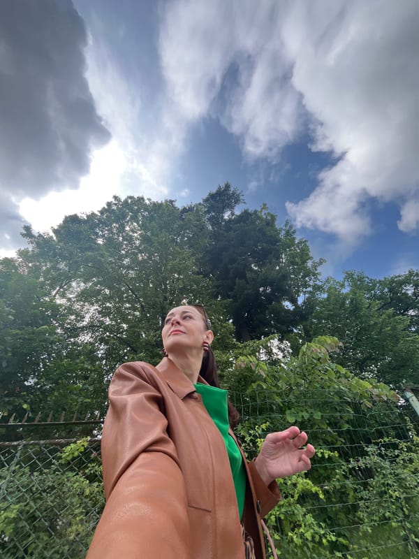 Green dress, leather jacket, city streets — a morning out