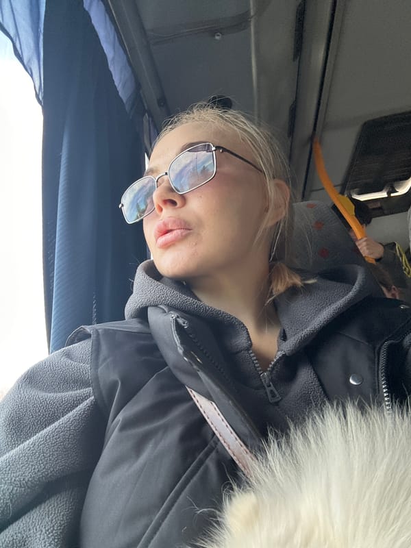 Woman rests on bus in Megion, Russia