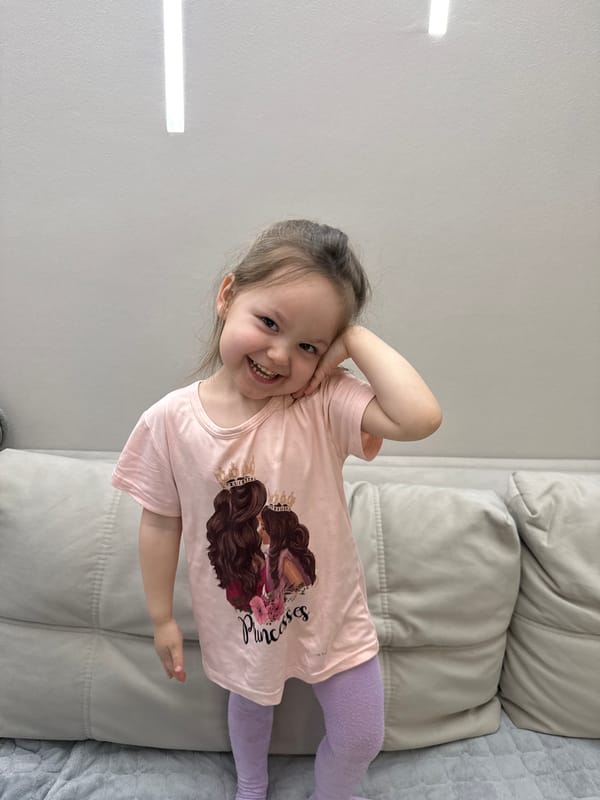 Child photographed smiling indoors in Izhevsk, Russia